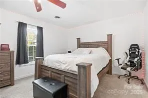 a bathroom with a sink a toilet and shower curtain