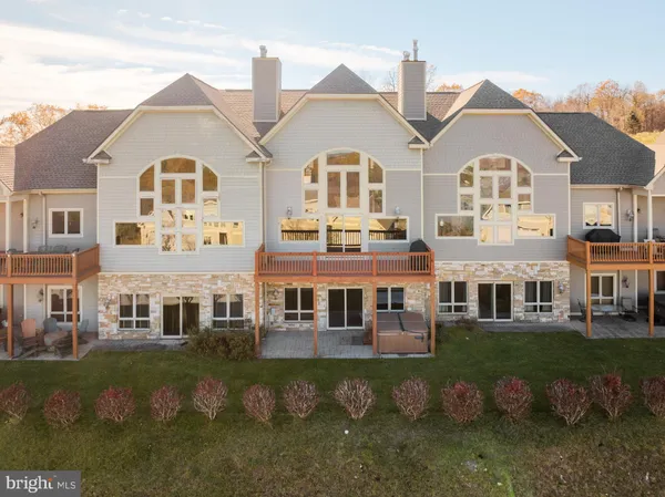 a front view of residential houses with outdoor space