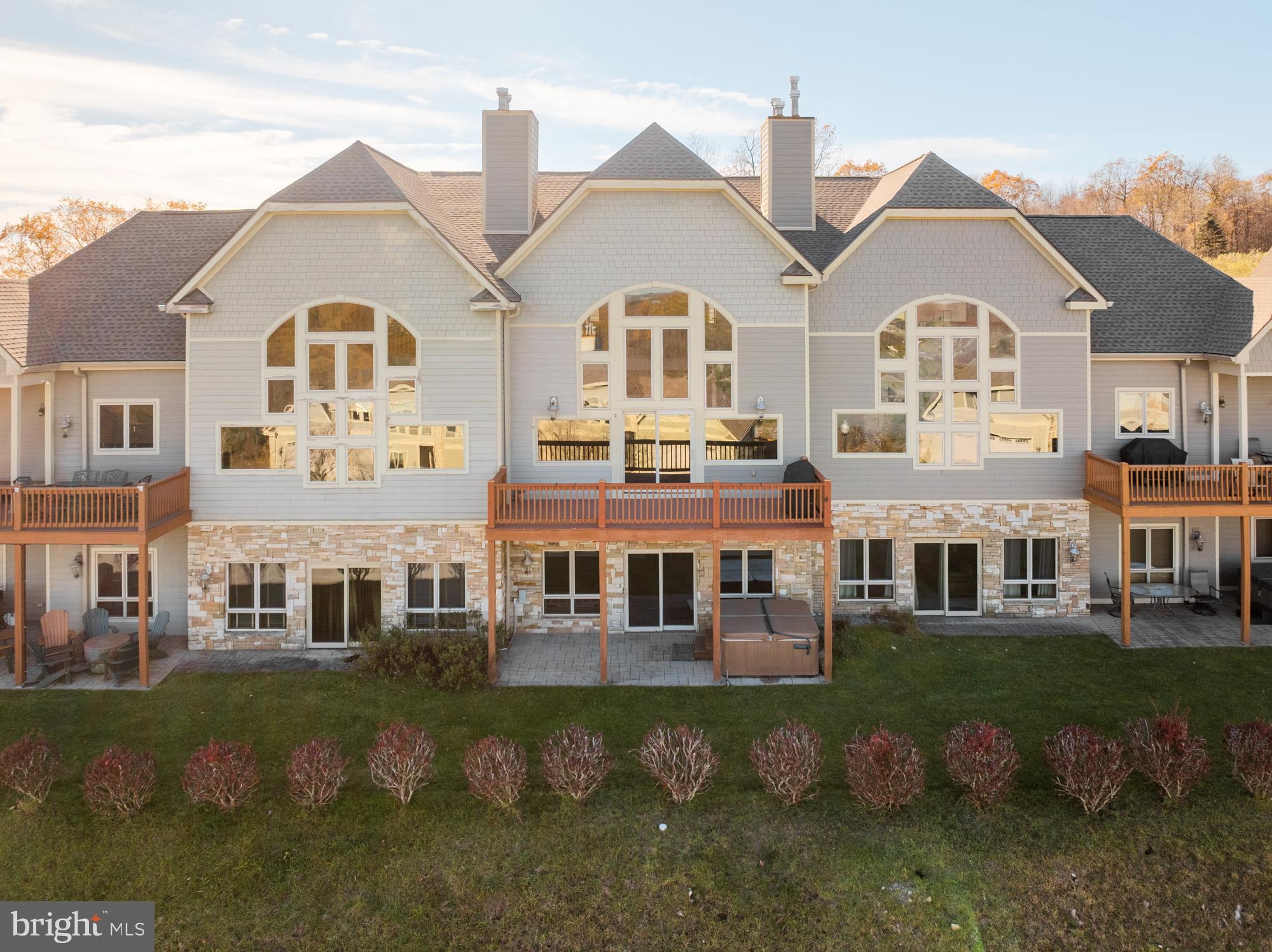 a front view of residential houses with outdoor space