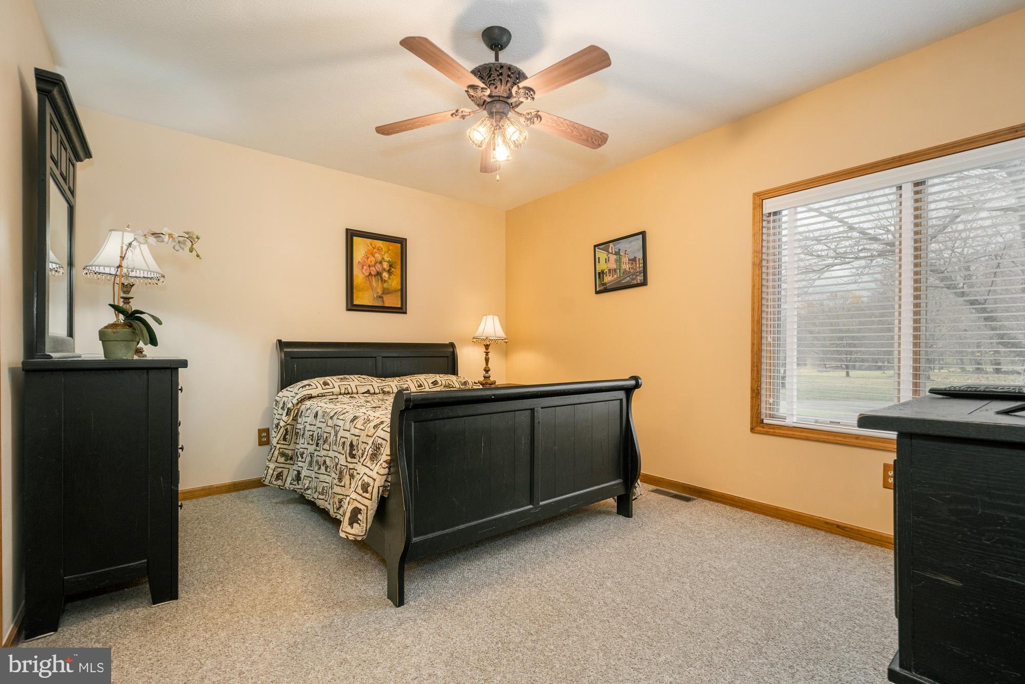 750 Wisp Mountain Road, Unit B McHenry, MD 21541 - Photo 14 of 49 a bed room with a bed and a window