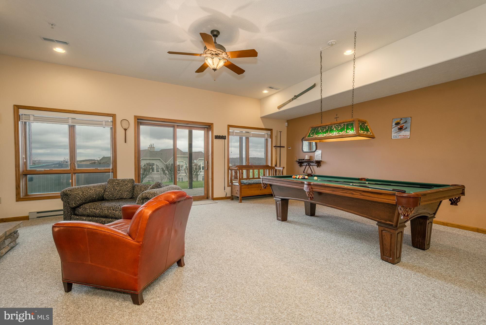 750 Wisp Mountain Road, Unit B McHenry, MD 21541 - Photo 20 of 49 a reading room with furniture and a ceiling fan