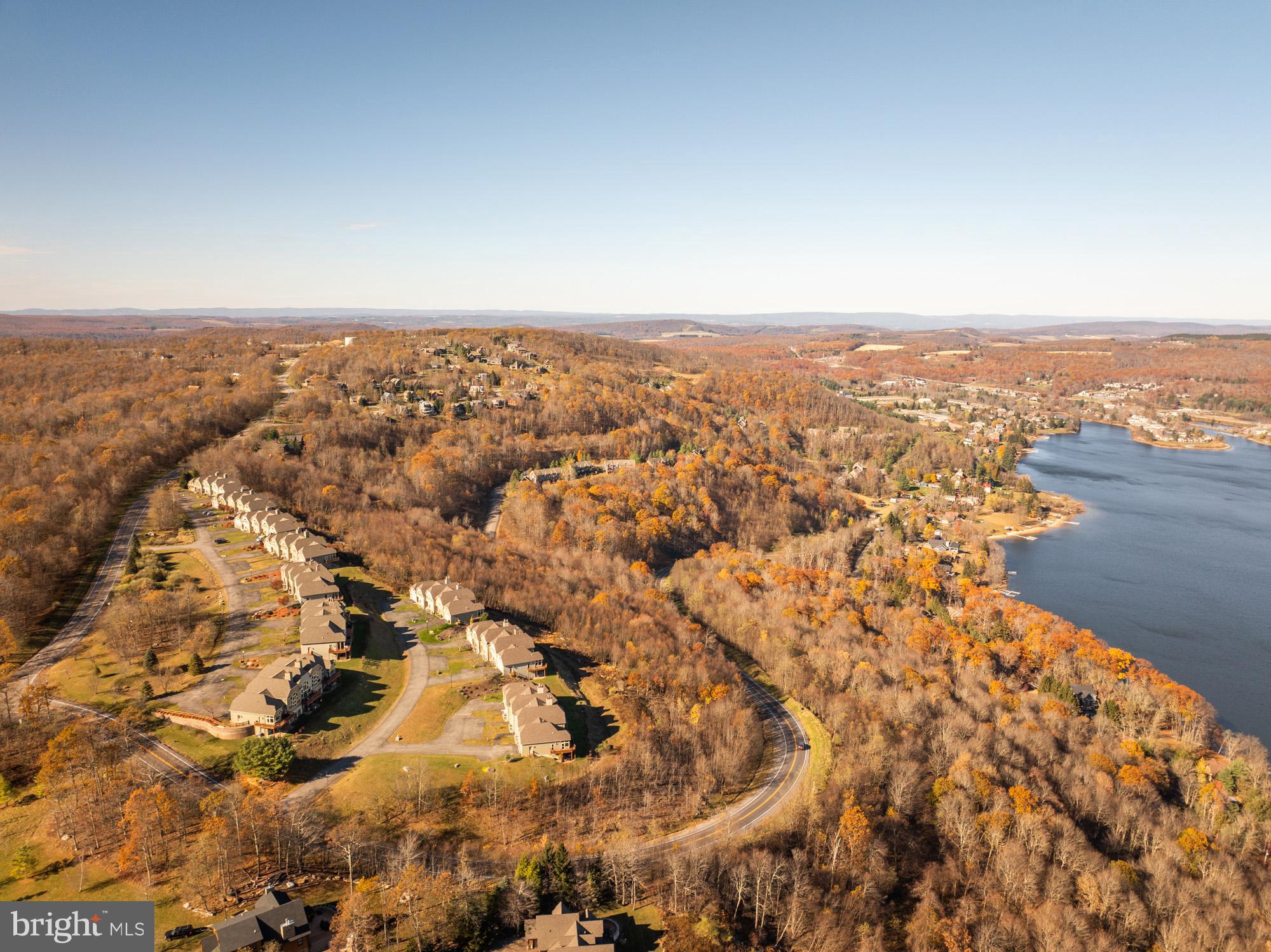 750 Wisp Mountain Road, Unit B McHenry, MD 21541 - Photo 2 of 49 an aerial view of house with yard and mountain view in back