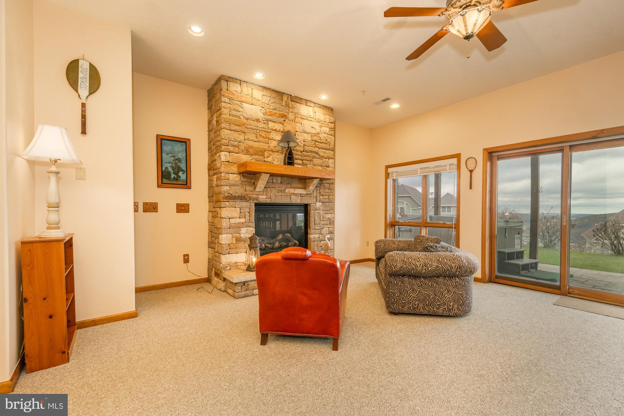 750 Wisp Mountain Road, Unit B McHenry, MD 21541 - Photo 21 of 49 a living room with furniture and a fireplace