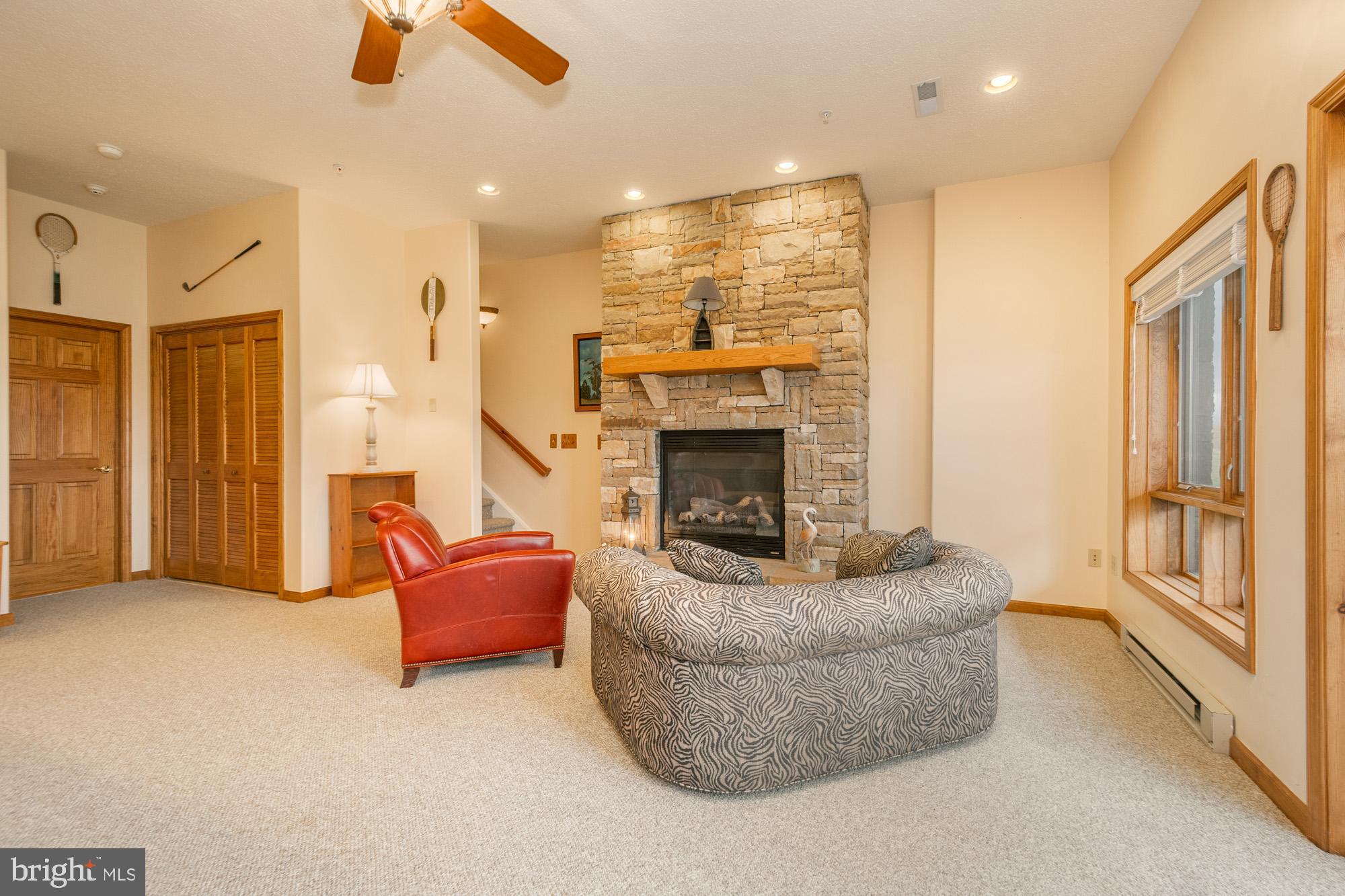 750 Wisp Mountain Road, Unit B McHenry, MD 21541 - Photo 22 of 49 a living room with furniture and a fireplace