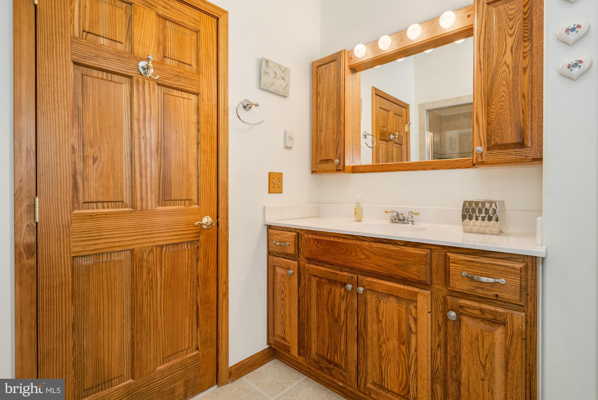 750 Wisp Mountain Road, Unit B McHenry, MD 21541 - Photo 29 of 49 a bathroom with a sink and a mirror