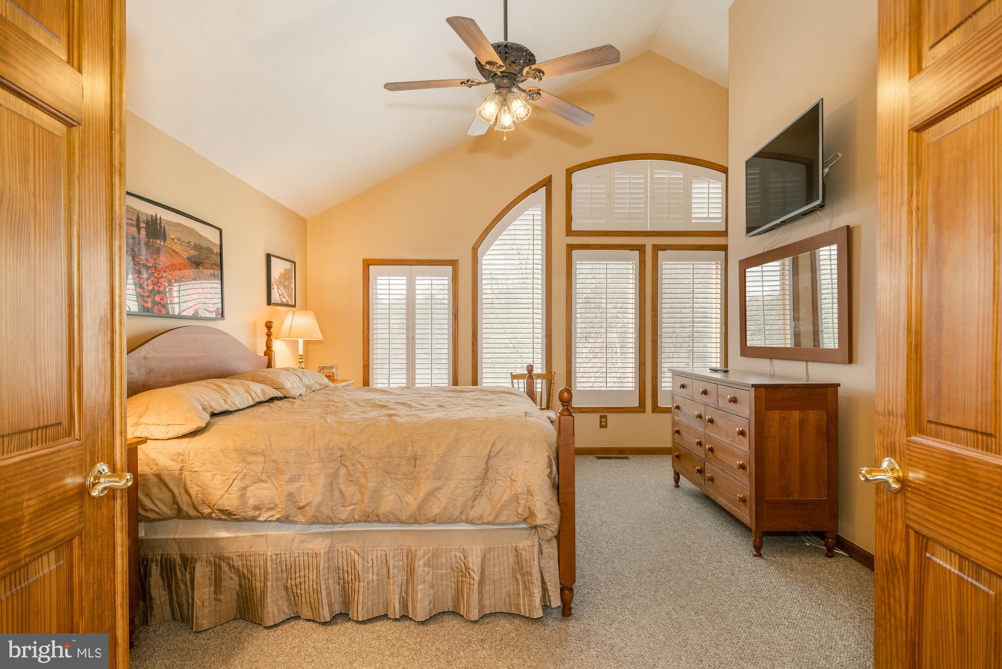 750 Wisp Mountain Road, Unit B McHenry, MD 21541 - Photo 31 of 49 a bedroom with a bed dresser and a window