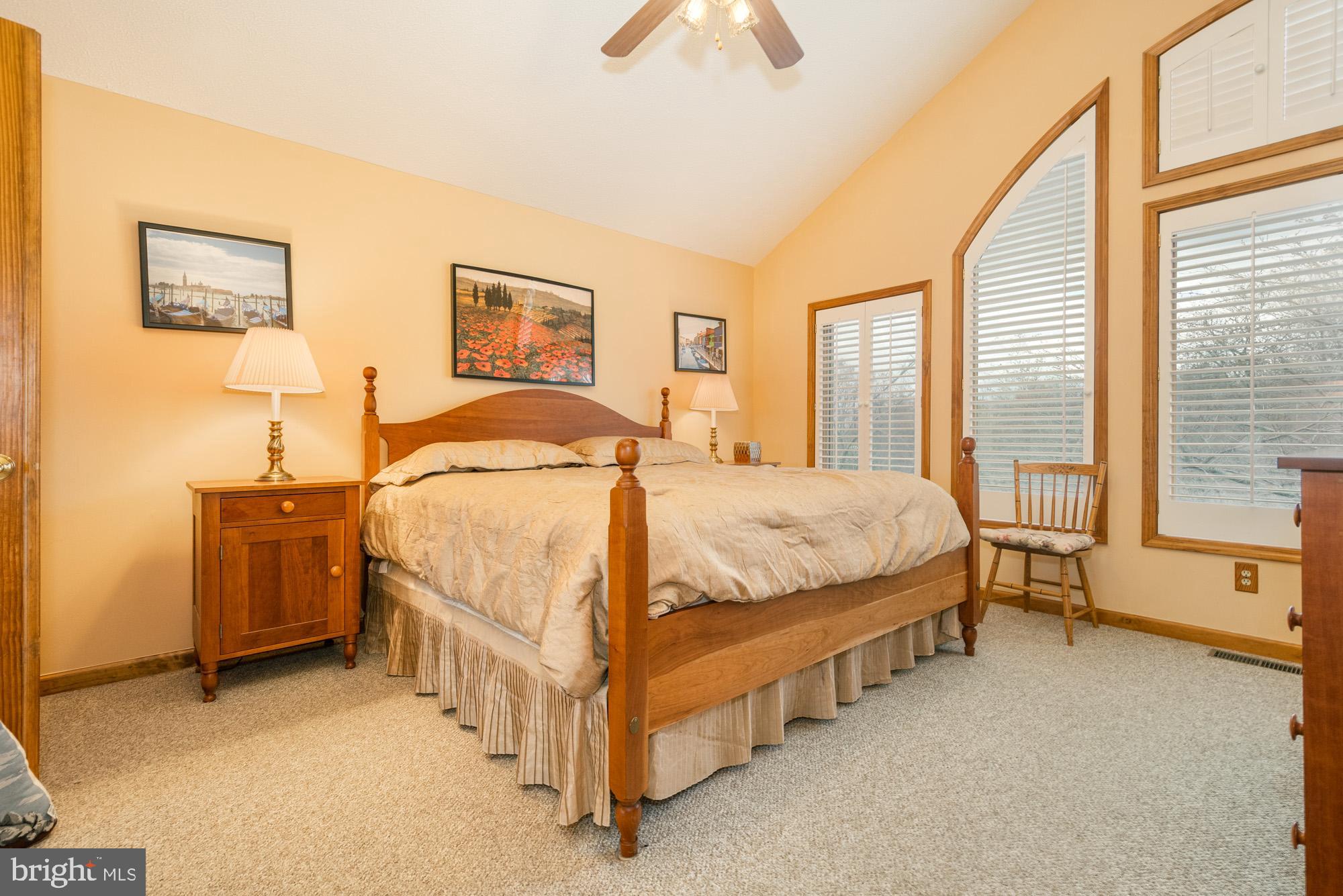 750 Wisp Mountain Road, Unit B McHenry, MD 21541 - Photo 32 of 49 a bedroom with a bed and a table lamp