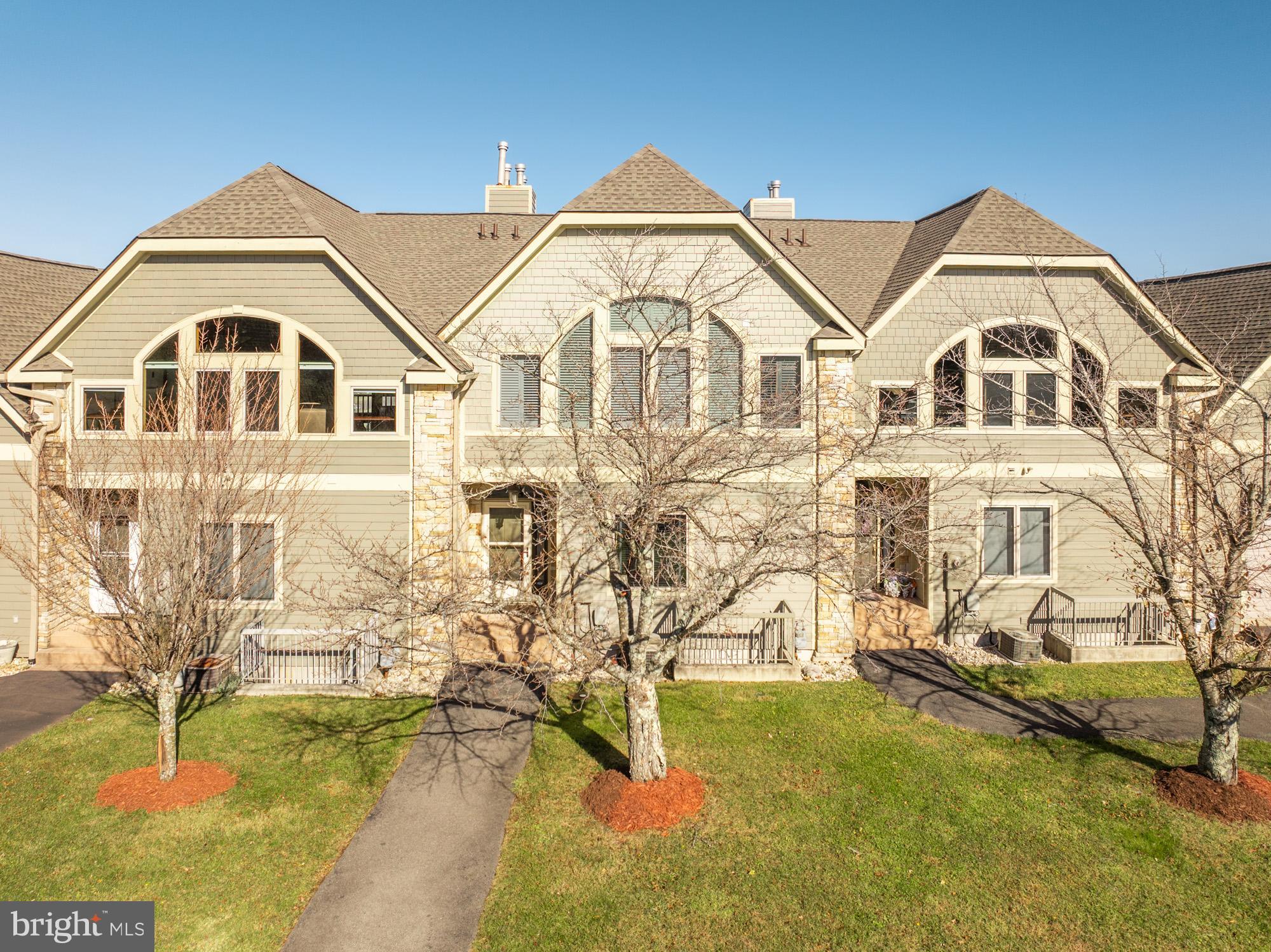 750 Wisp Mountain Road, Unit B McHenry, MD 21541 - Photo 45 of 49 a view of a large white house with a yard