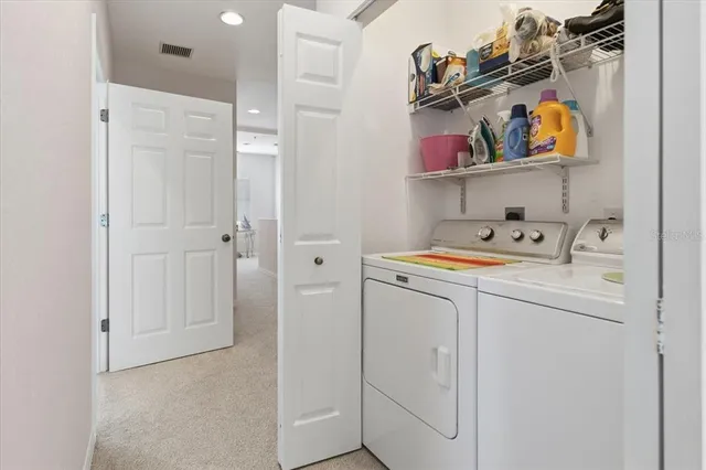 a bedroom with two beds and a window