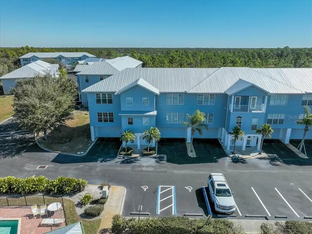 an aerial view of a house with a garden