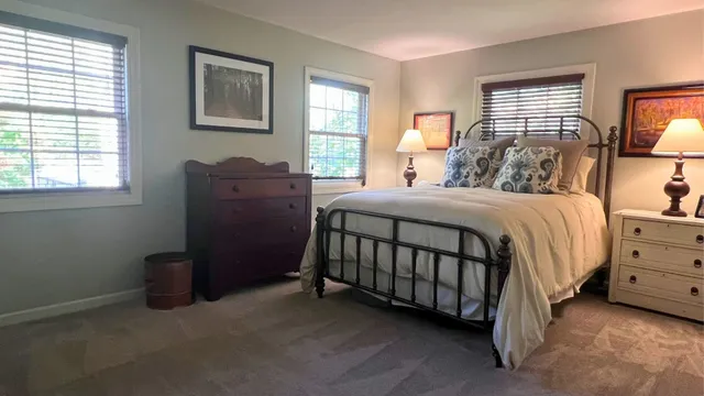 a livingroom with workspace and a window