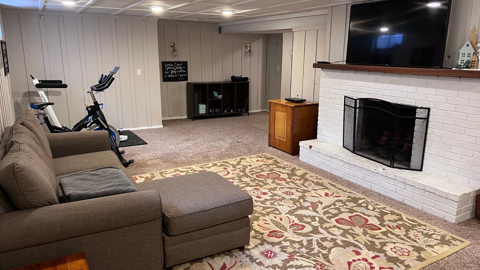 101 West Mill Road Sheffield, IL 61361 - Photo 18 of 26 a living room with furniture a flat screen tv and a fireplace