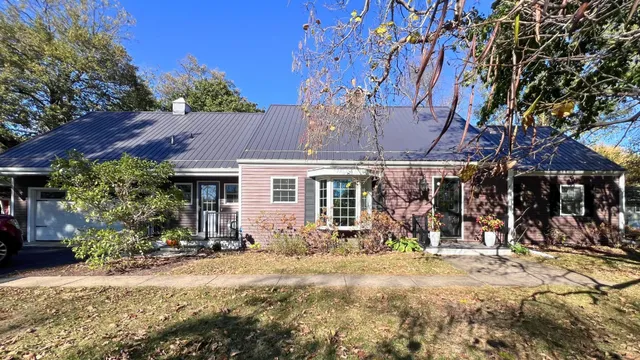a view of a house with a tree