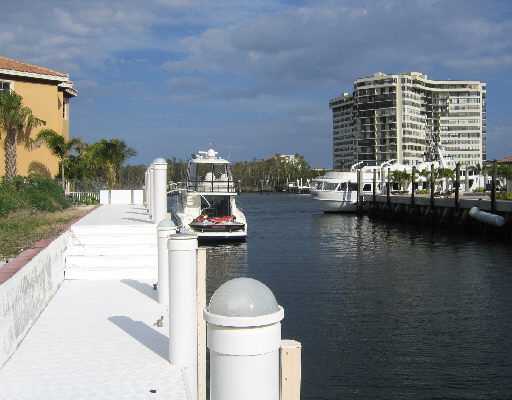 864 Enfield Street Boca Raton, FL 33487 - Photo 1 of 2 a view of a lake with tall buildings