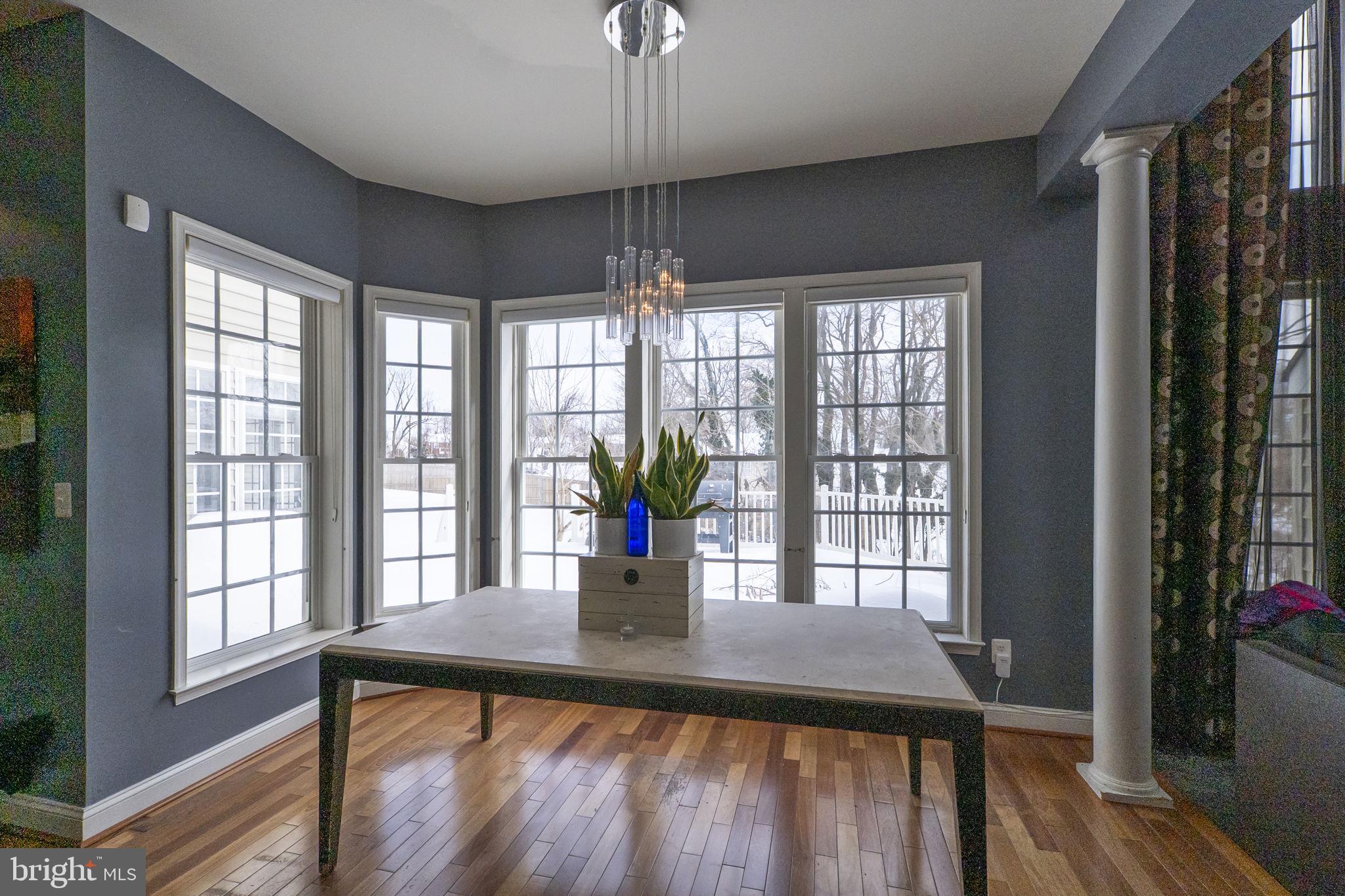 8400 Summit Avenue Baltimore, MD 21244 - Photo 13 of 55 a view of a dining room with furniture window and wooden floor
