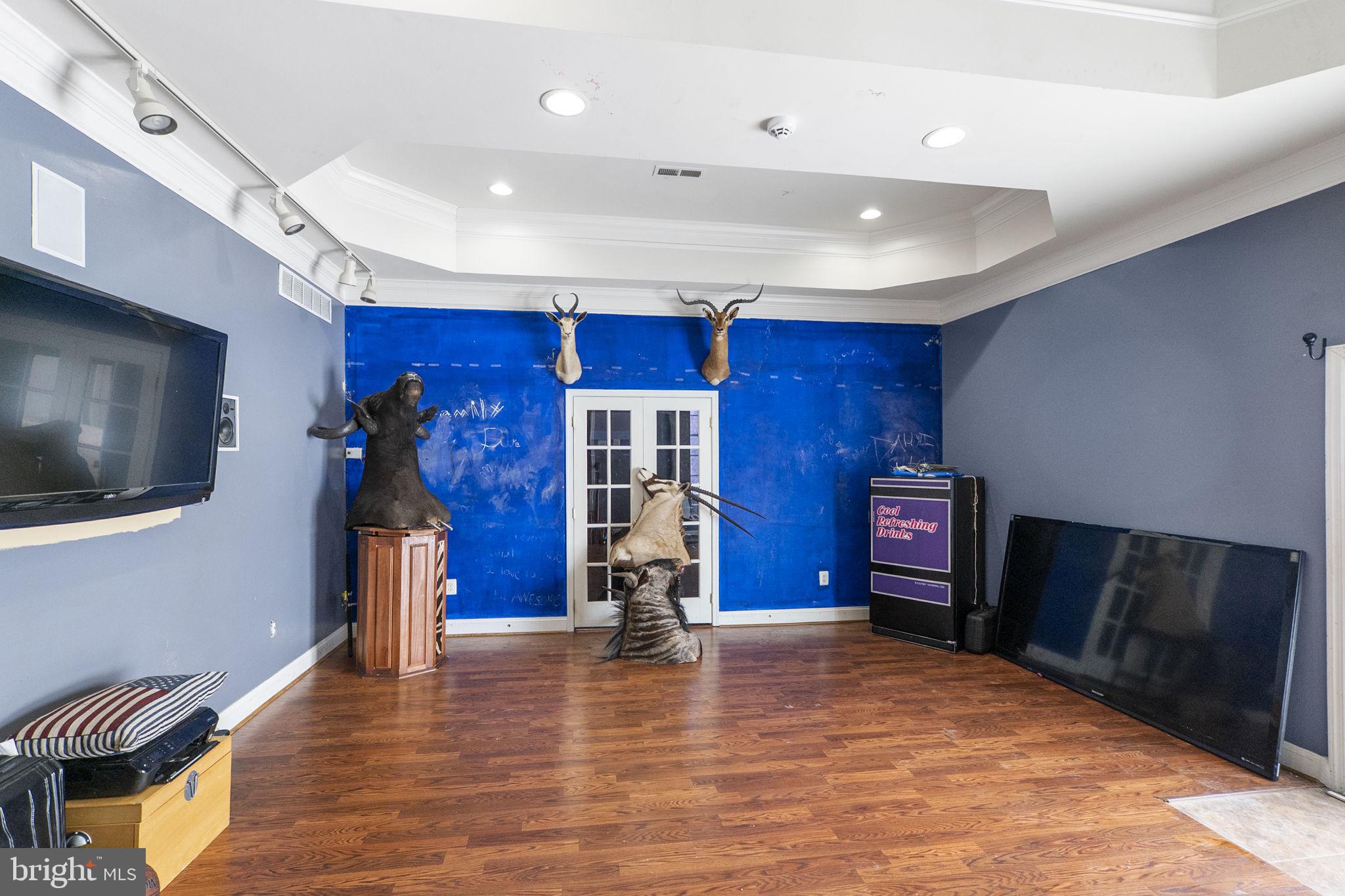 8400 Summit Avenue Baltimore, MD 21244 - Photo 22 of 55 a living room with furniture a flat screen tv and a fireplace