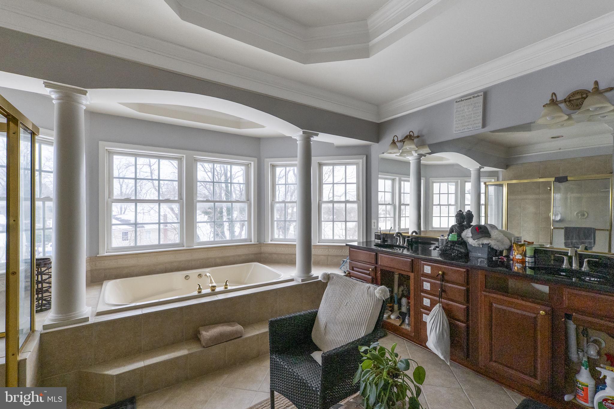 8400 Summit Avenue Baltimore, MD 21244 - Photo 31 of 55 a living room with furniture and large windows