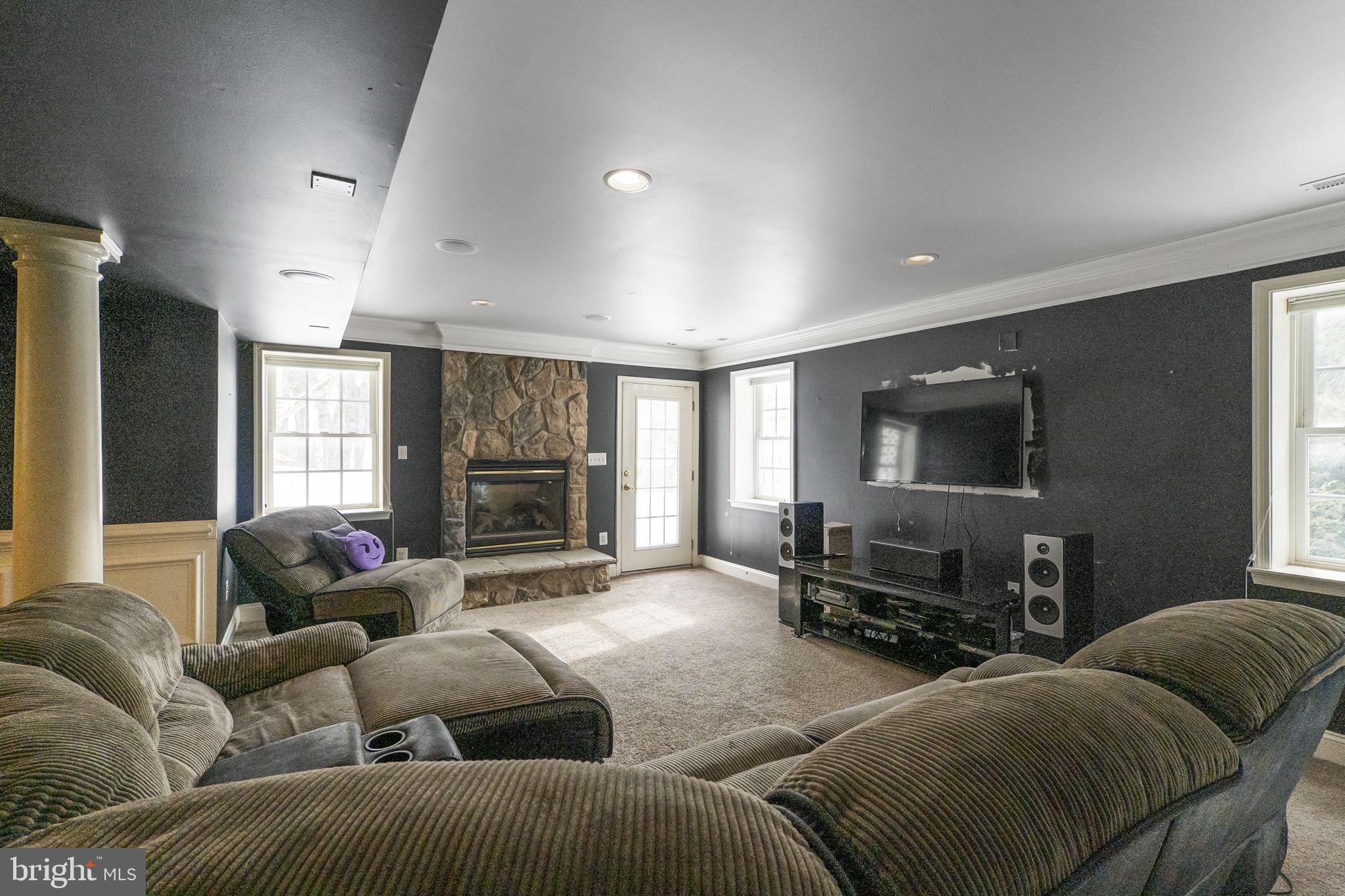 8400 Summit Avenue Baltimore, MD 21244 - Photo 38 of 55 a living room with furniture window and a flat screen tv