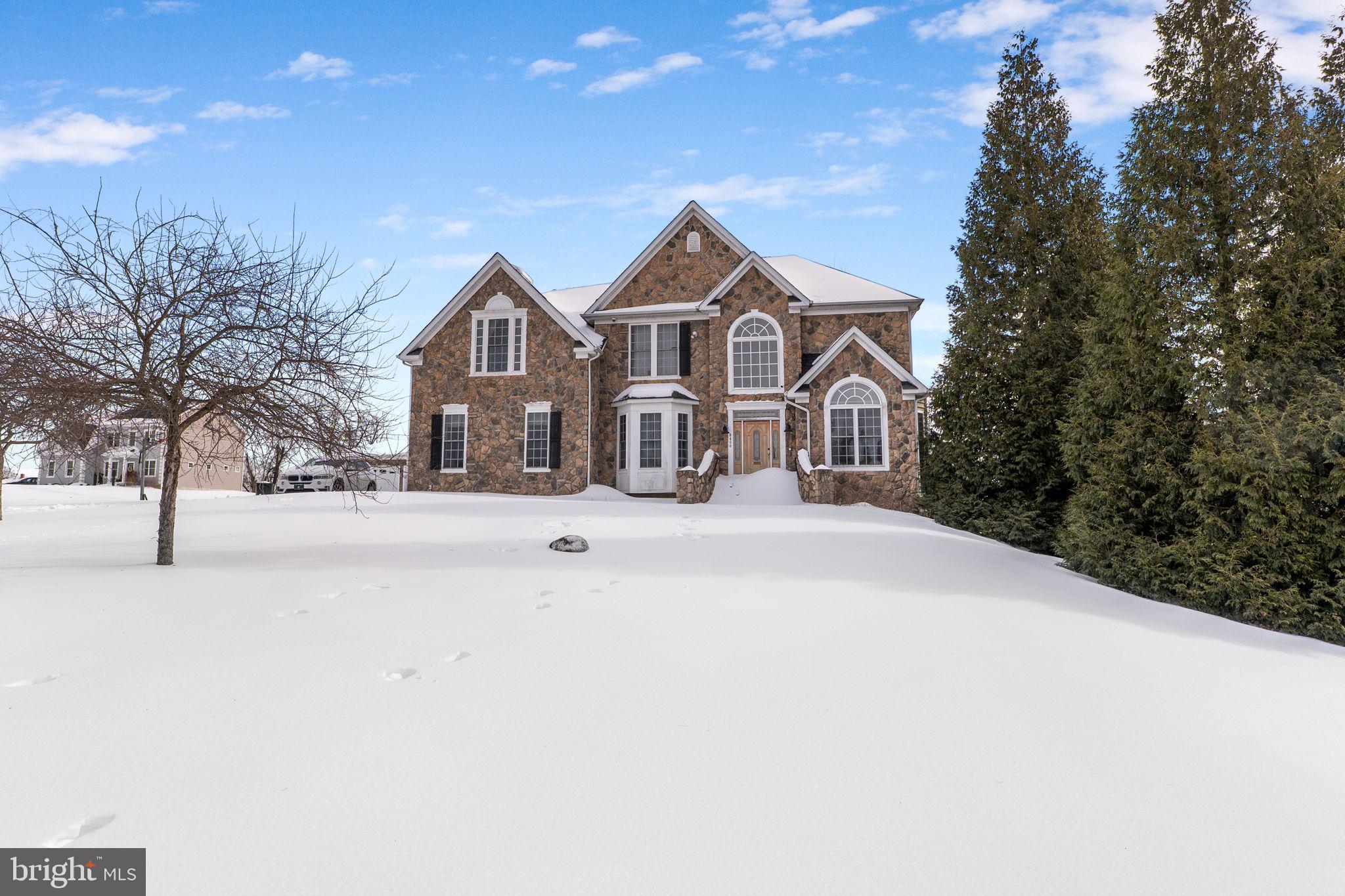 8400 Summit Avenue Baltimore, MD 21244 - Photo 50 of 55 a front view of a house with a yard covered in snow
