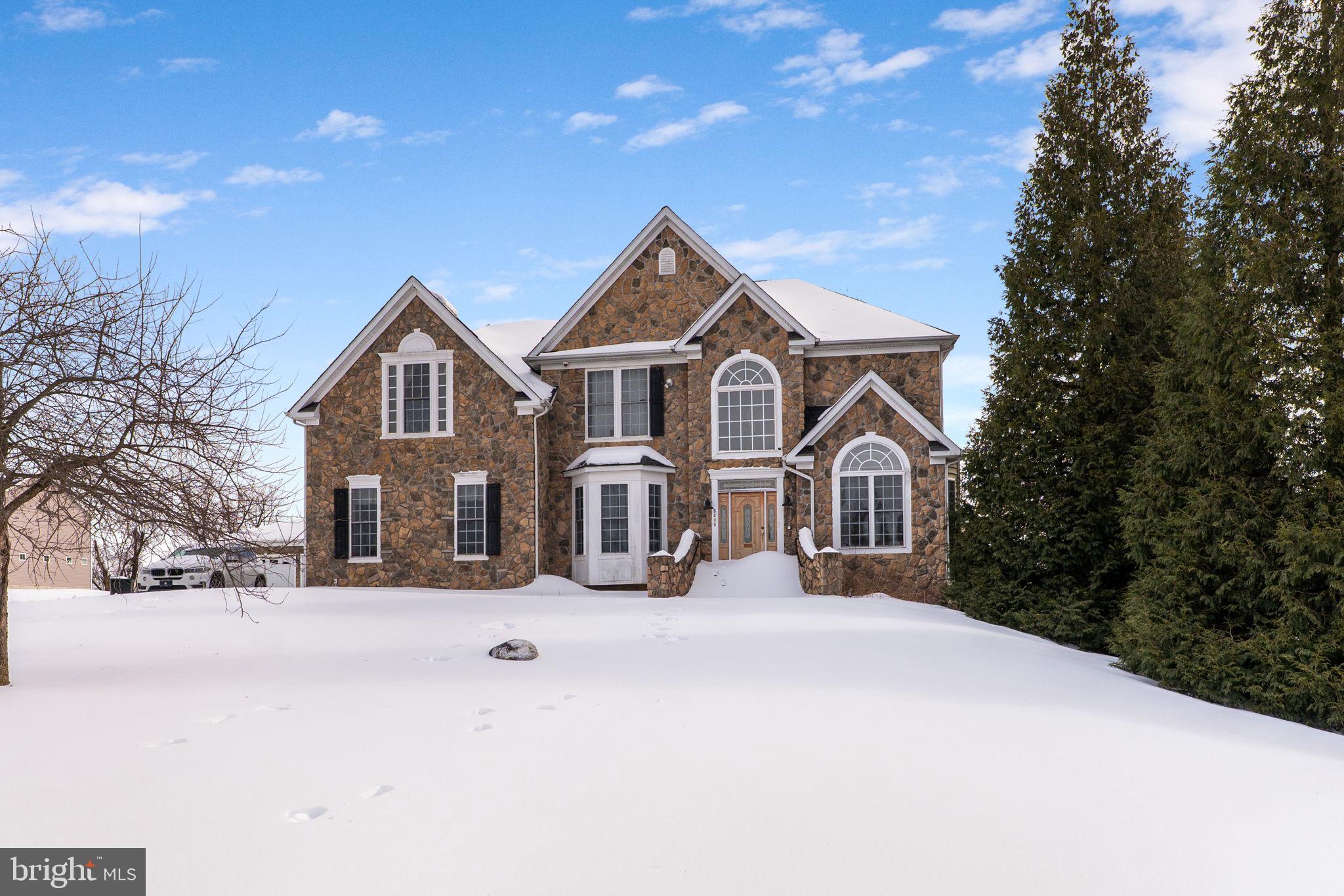 8400 Summit Avenue Baltimore, MD 21244 - Photo 52 of 55 a front view of a house with a yard covered in snow