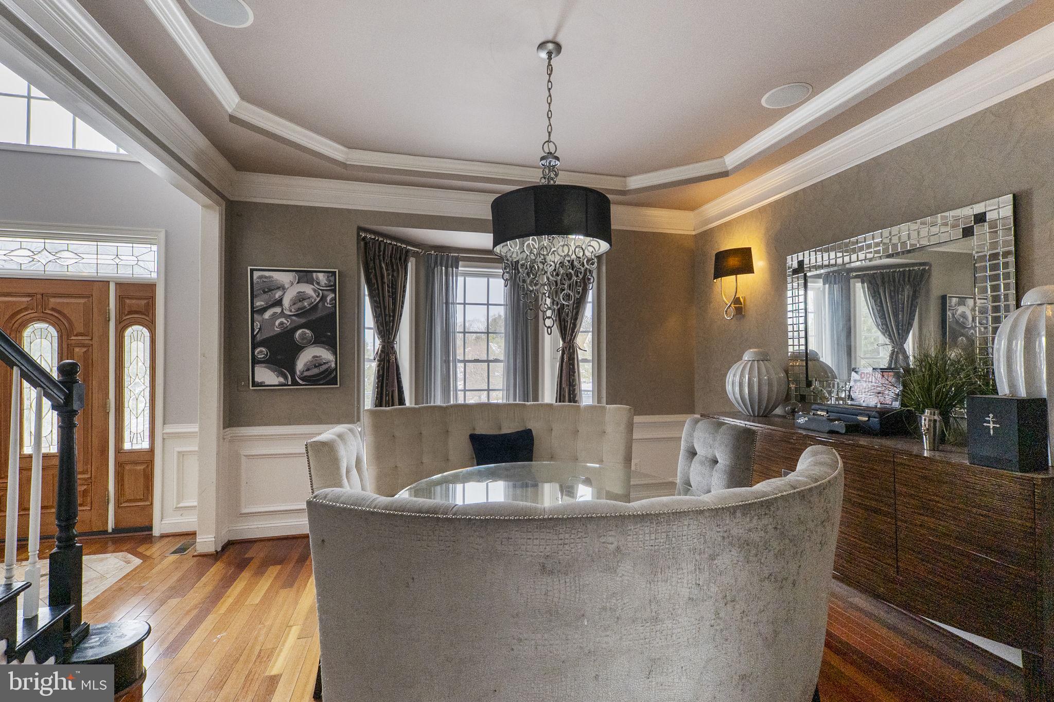 8400 Summit Avenue Baltimore, MD 21244 - Photo 7 of 55 a living room with fireplace furniture and a chandelier