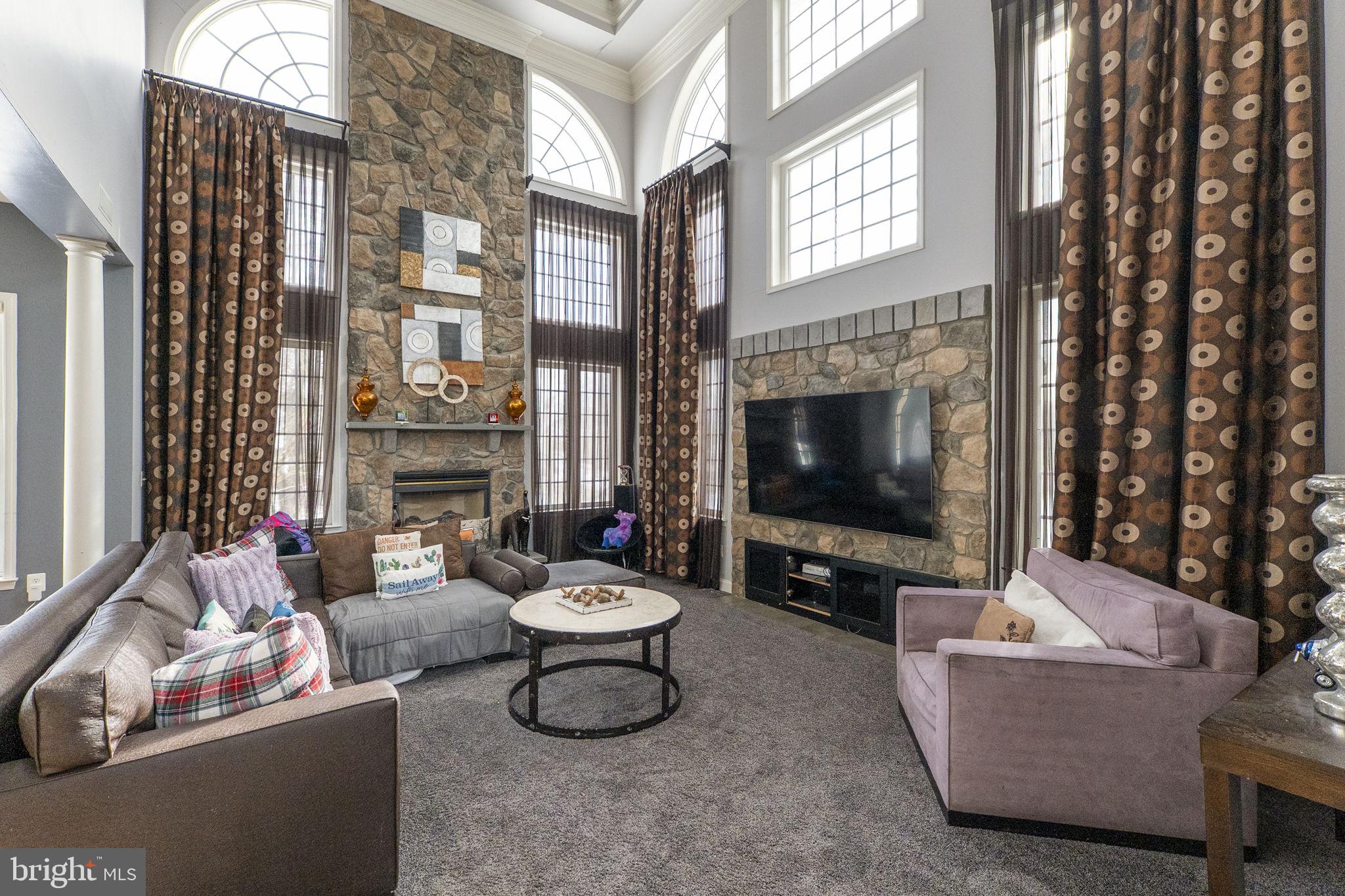 8400 Summit Avenue Baltimore, MD 21244 - Photo 8 of 55 a living room with furniture and a flat screen tv