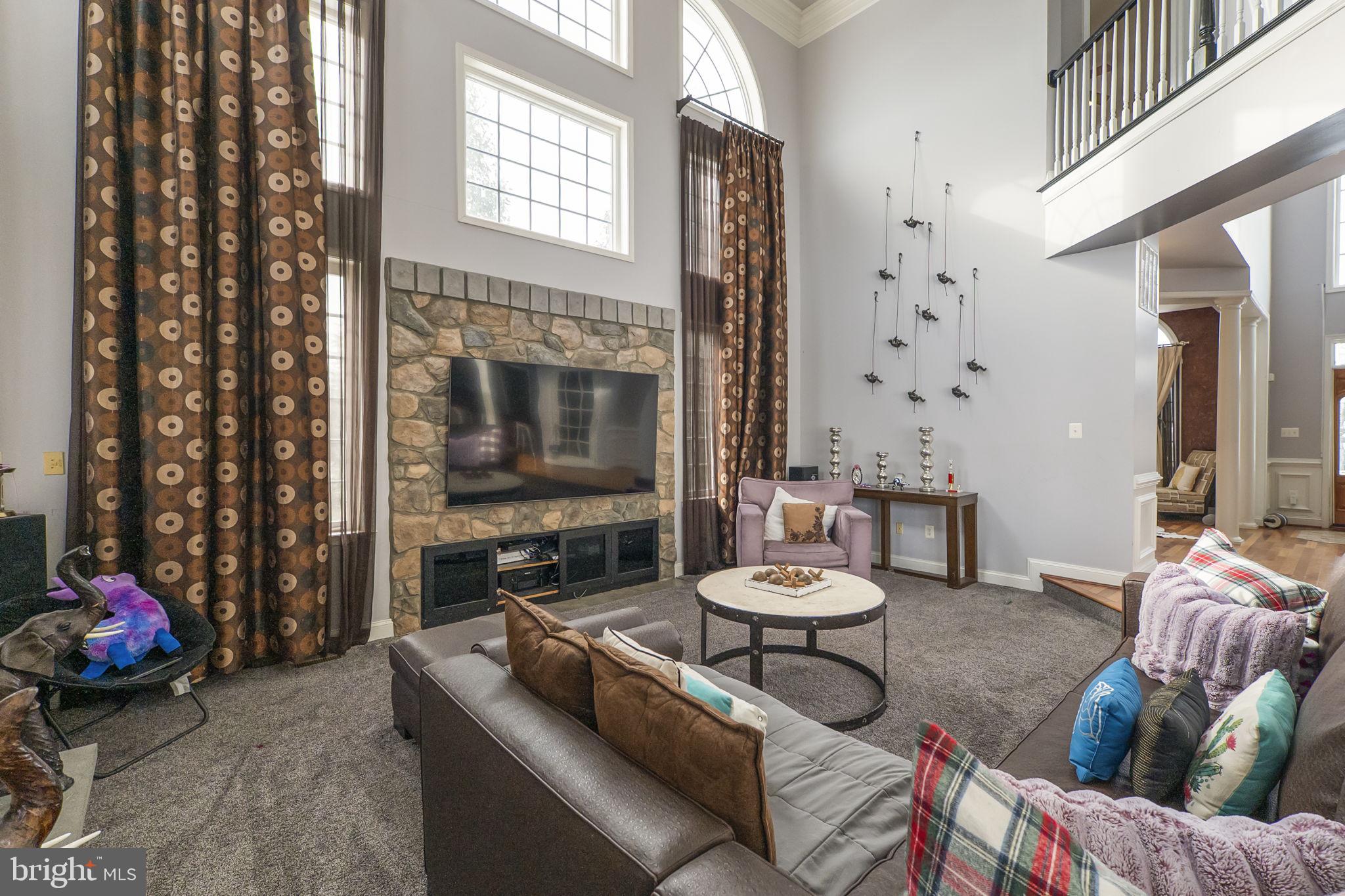 8400 Summit Avenue Baltimore, MD 21244 - Photo 9 of 55 a living room with furniture and a floor to ceiling window