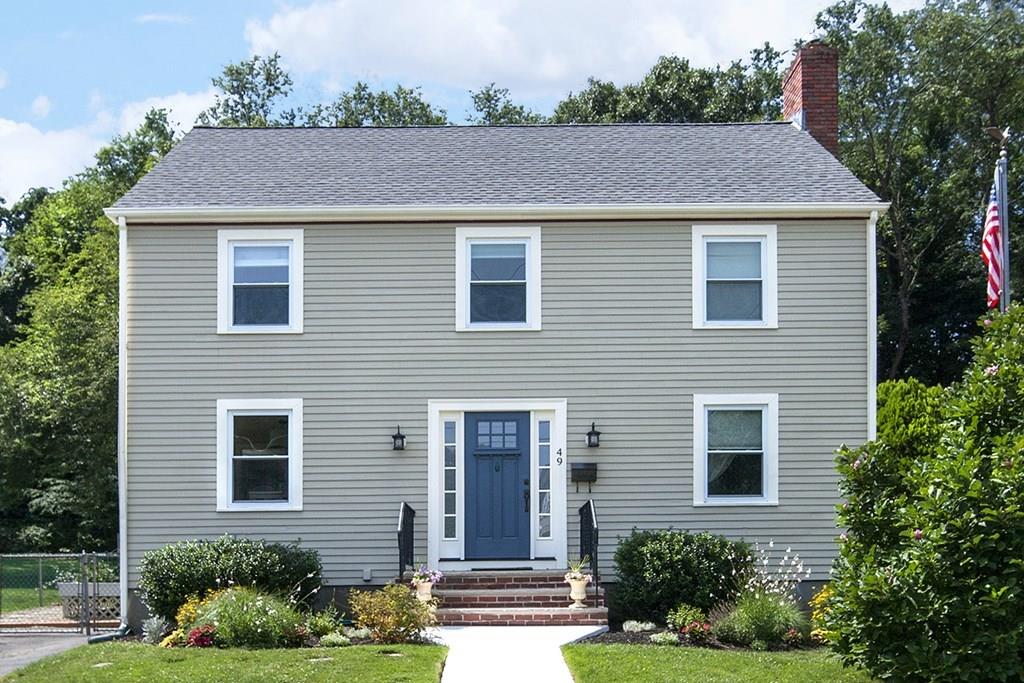 49 Moffatt Road Salem, MA 01970 - Photo 1 of 25 a front view of a house with a yard
