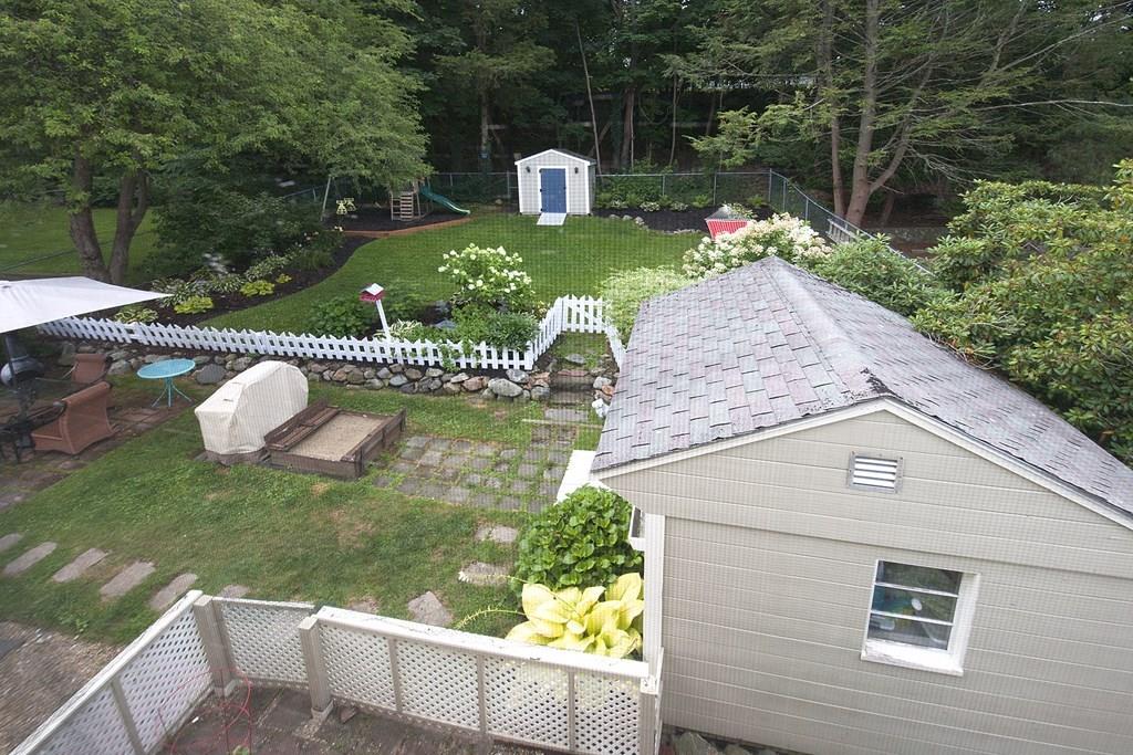 49 Moffatt Road Salem, MA 01970 - Photo 19 of 25 a front view of a house with garden