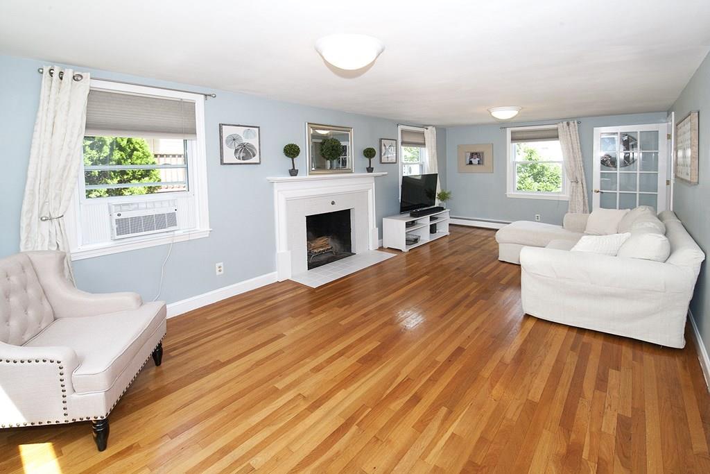 49 Moffatt Road Salem, MA 01970 - Photo 8 of 25 a bedroom with furniture and a fireplace