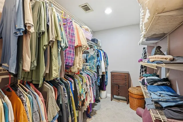 an aerial view of a residential houses with outdoor space and street view