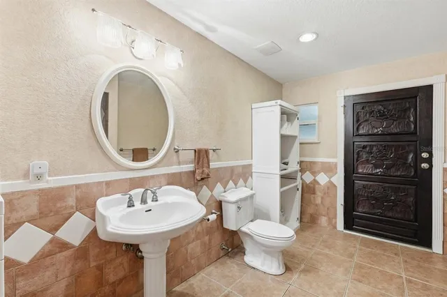 a view of a room with stairs and wooden floor