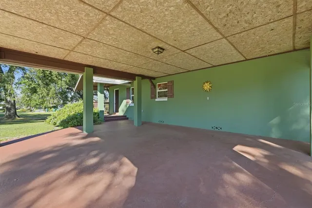 a living room with furniture rug and window