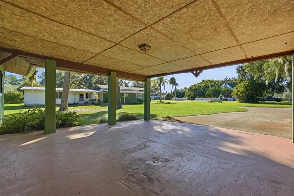 a living room with furniture rug and window