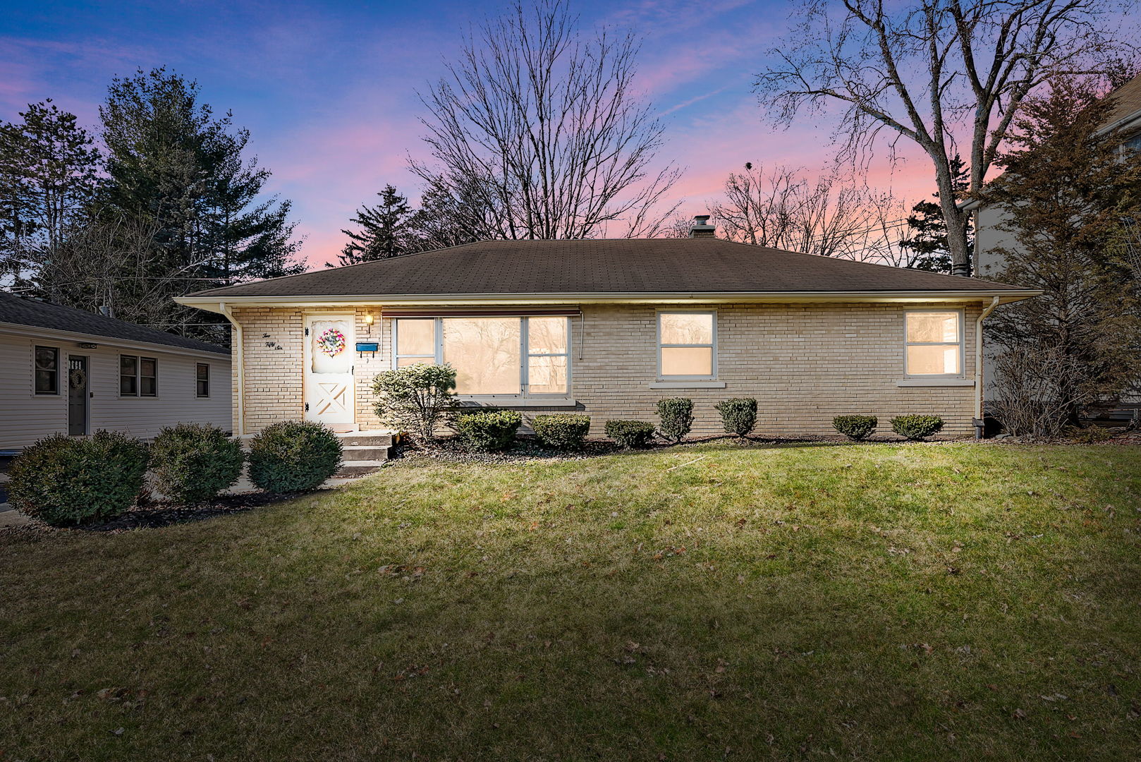 256 North Jackson Road Clarendon Hills, IL 60514 - Photo 1 of 30 a front view of house with yard and green space