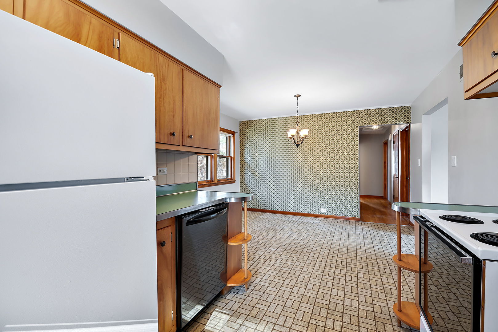 256 North Jackson Road Clarendon Hills, IL 60514 - Photo 11 of 30 a kitchen with stainless steel appliances granite countertop a refrigerator and a stove