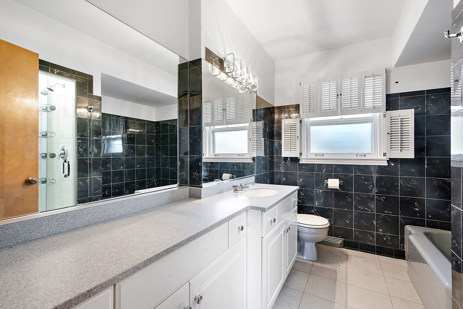 256 North Jackson Road Clarendon Hills, IL 60514 - Photo 13 of 30 a bathroom with a sink toilet and shower