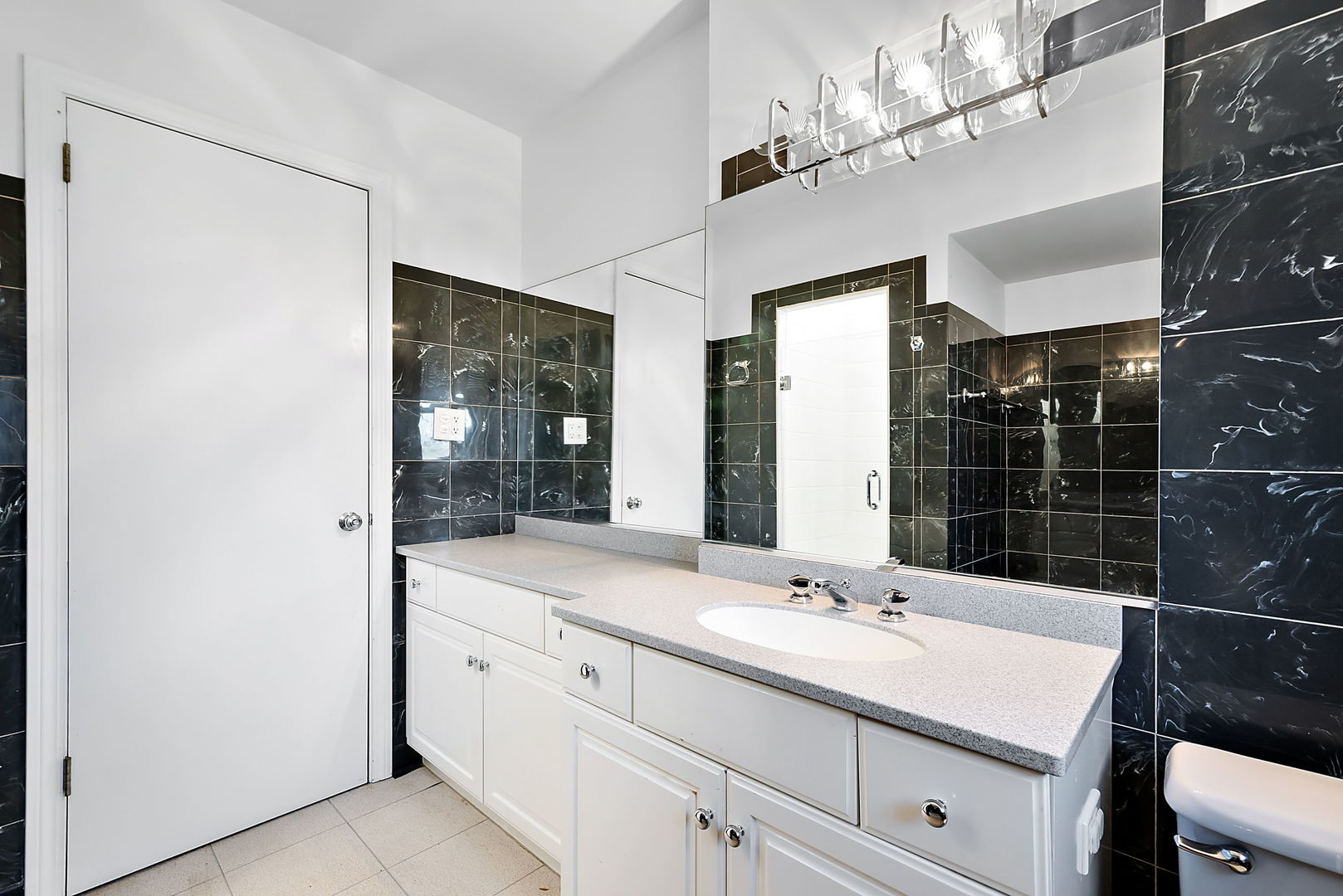 256 North Jackson Road Clarendon Hills, IL 60514 - Photo 14 of 30 a bathroom with a sink shower and a mirror