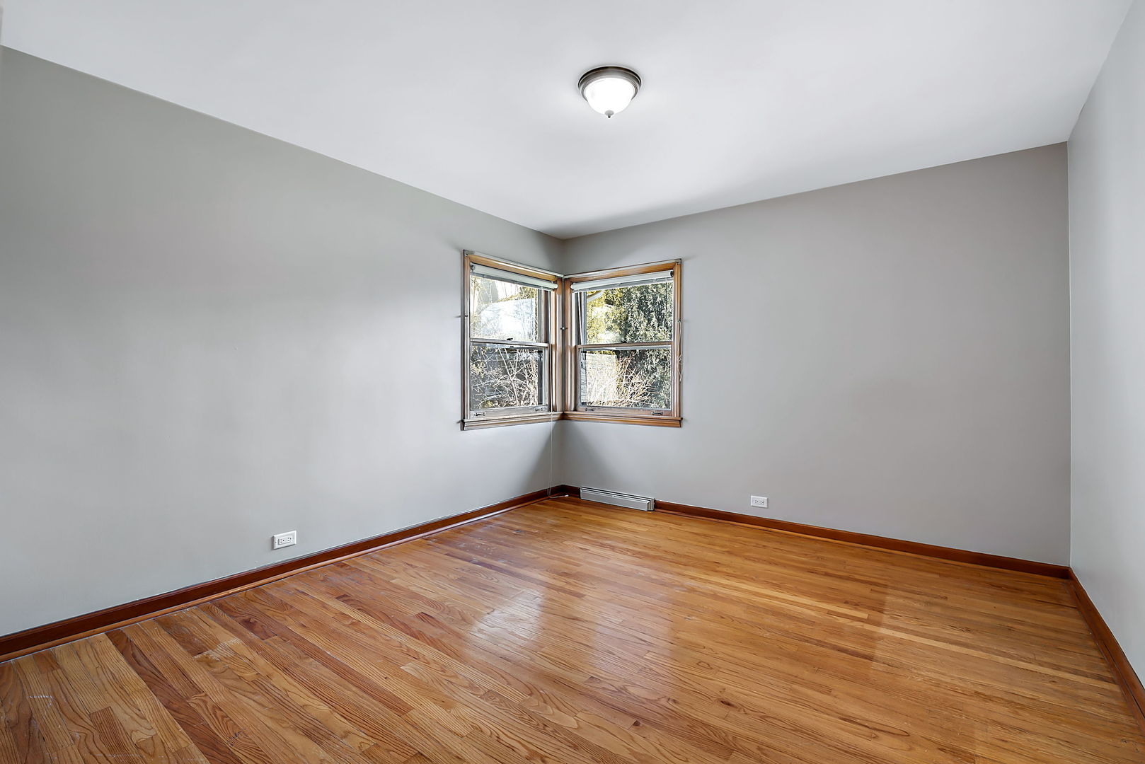 256 North Jackson Road Clarendon Hills, IL 60514 - Photo 16 of 30 an empty room with wooden floor and windows