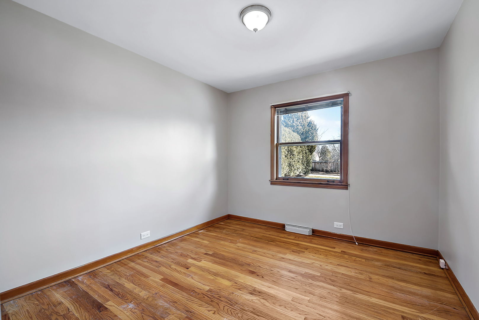 256 North Jackson Road Clarendon Hills, IL 60514 - Photo 17 of 30 an empty room with a window