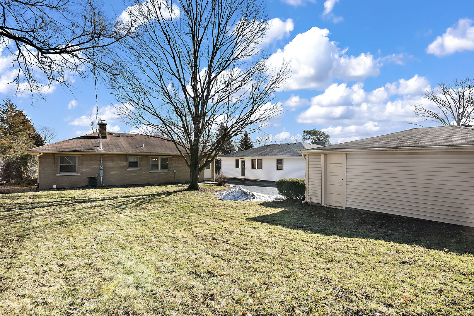 256 North Jackson Road Clarendon Hills, IL 60514 - Photo 21 of 30 a front view of a house with a yard