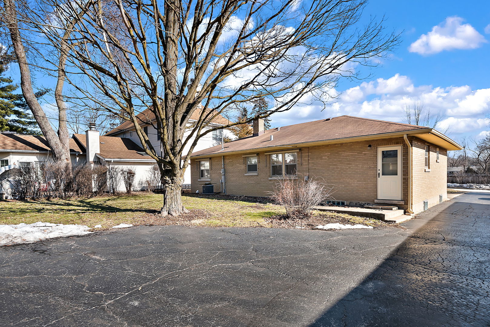 256 North Jackson Road Clarendon Hills, IL 60514 - Photo 22 of 30 a view of large house with a yard and large tree