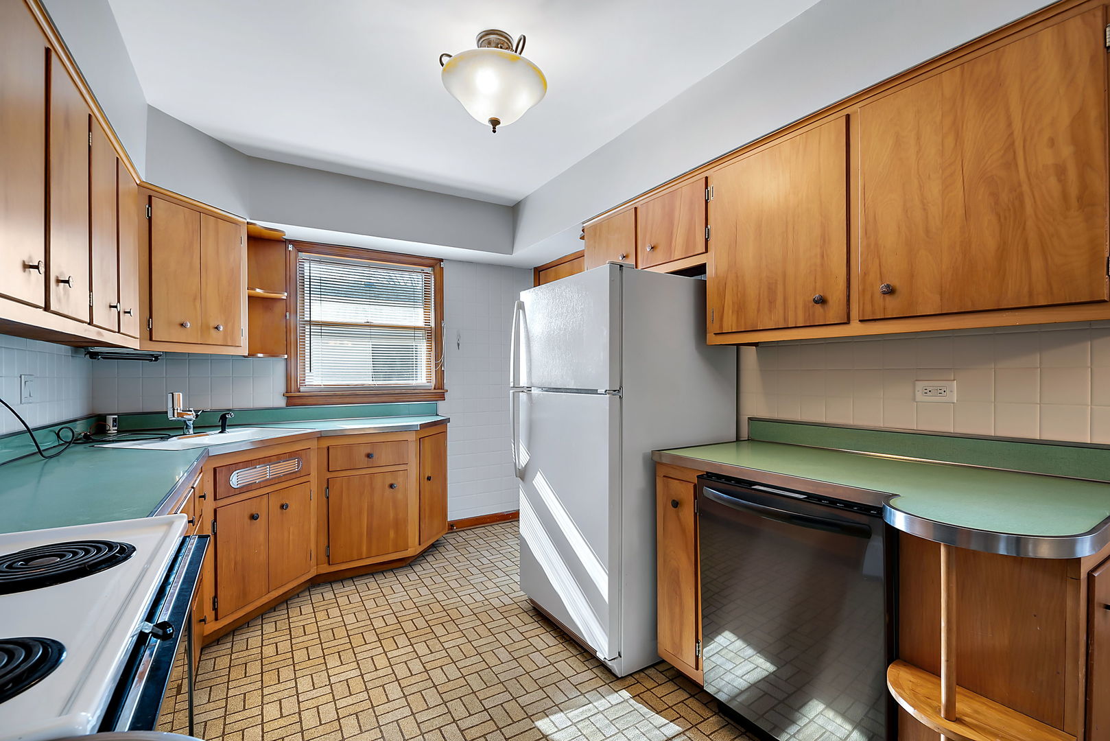 256 North Jackson Road Clarendon Hills, IL 60514 - Photo 9 of 30 a kitchen with stainless steel appliances granite countertop a refrigerator a sink dishwasher and wooden cabinets