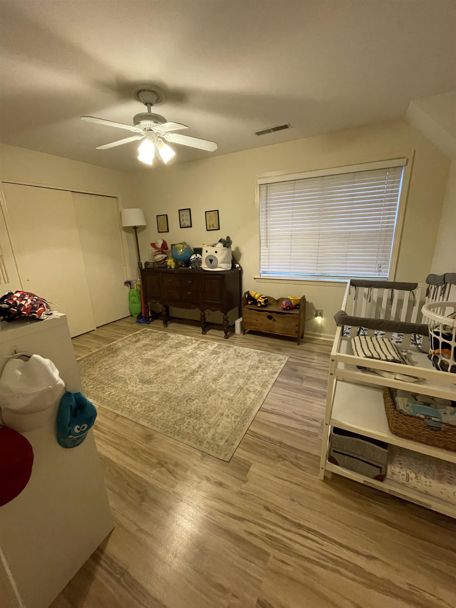 363 South Fenwick Road Memphis, TN 38111 - Photo 13 of 19 a spacious bedroom with a bed and a chandelier