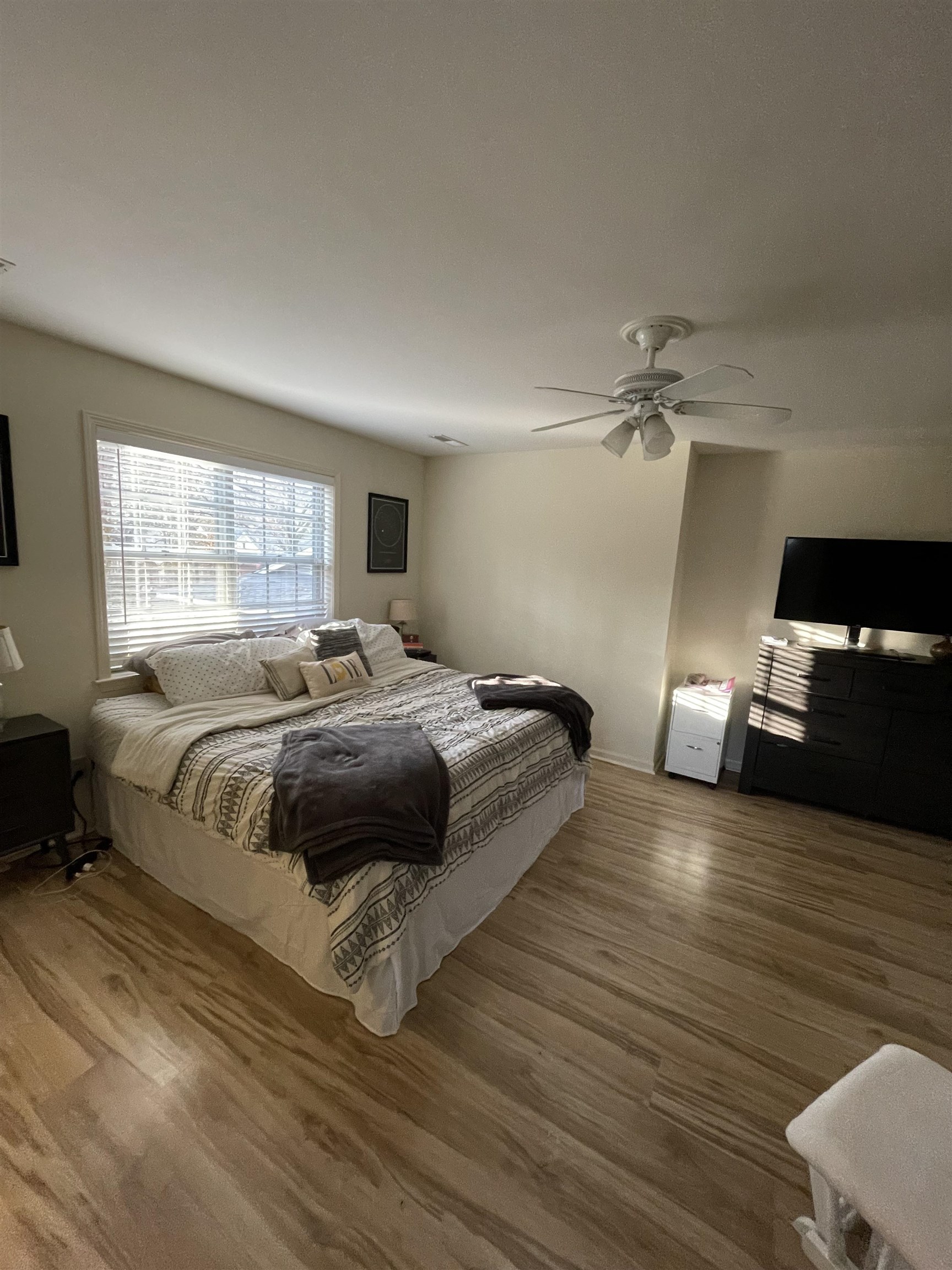 363 South Fenwick Road Memphis, TN 38111 - Photo 16 of 19 a bedroom with a bed and wooden floor