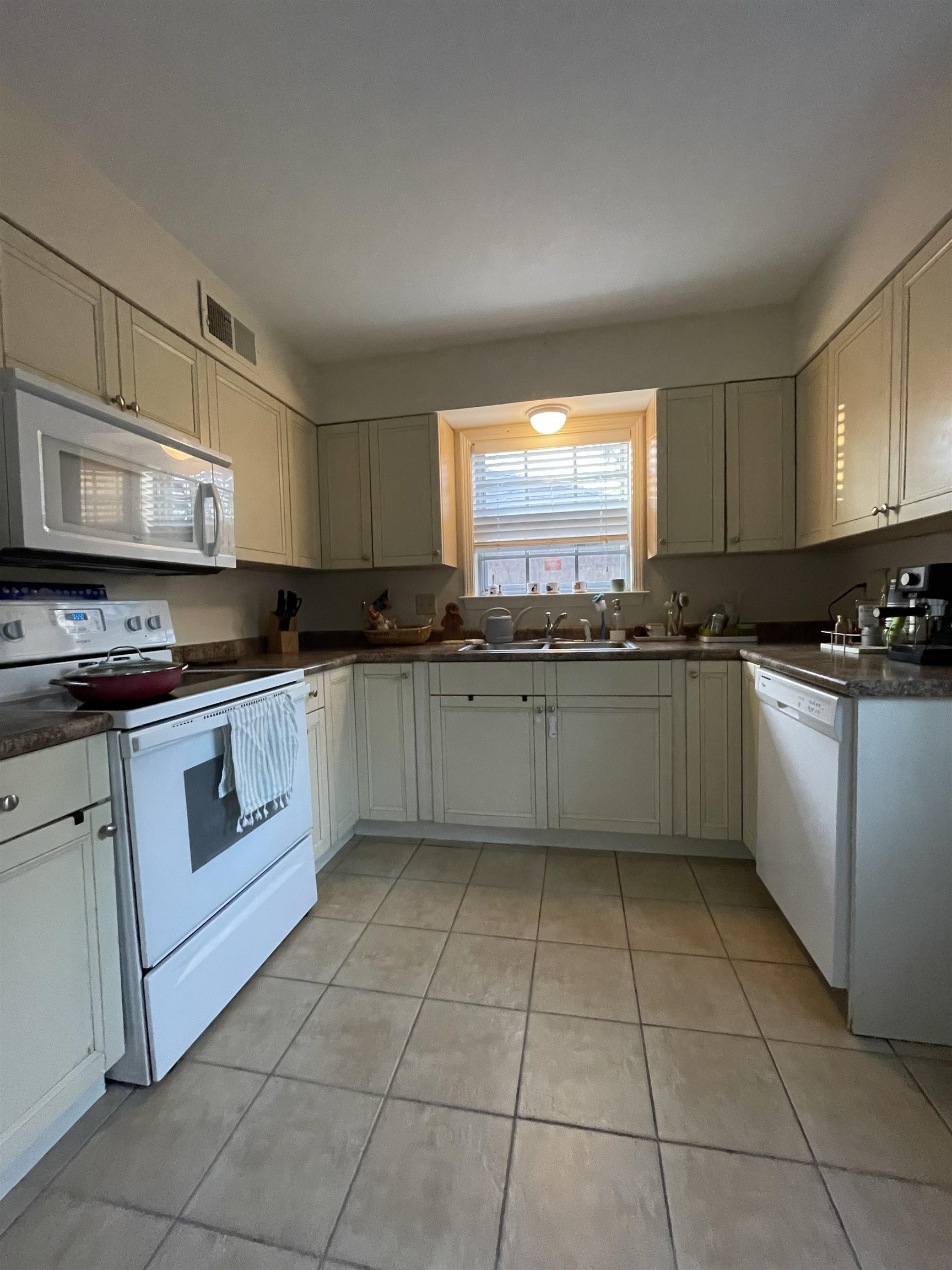 363 South Fenwick Road Memphis, TN 38111 - Photo 7 of 19 a kitchen with stainless steel appliances granite countertop a sink a stove a microwave a counter top and cabinets