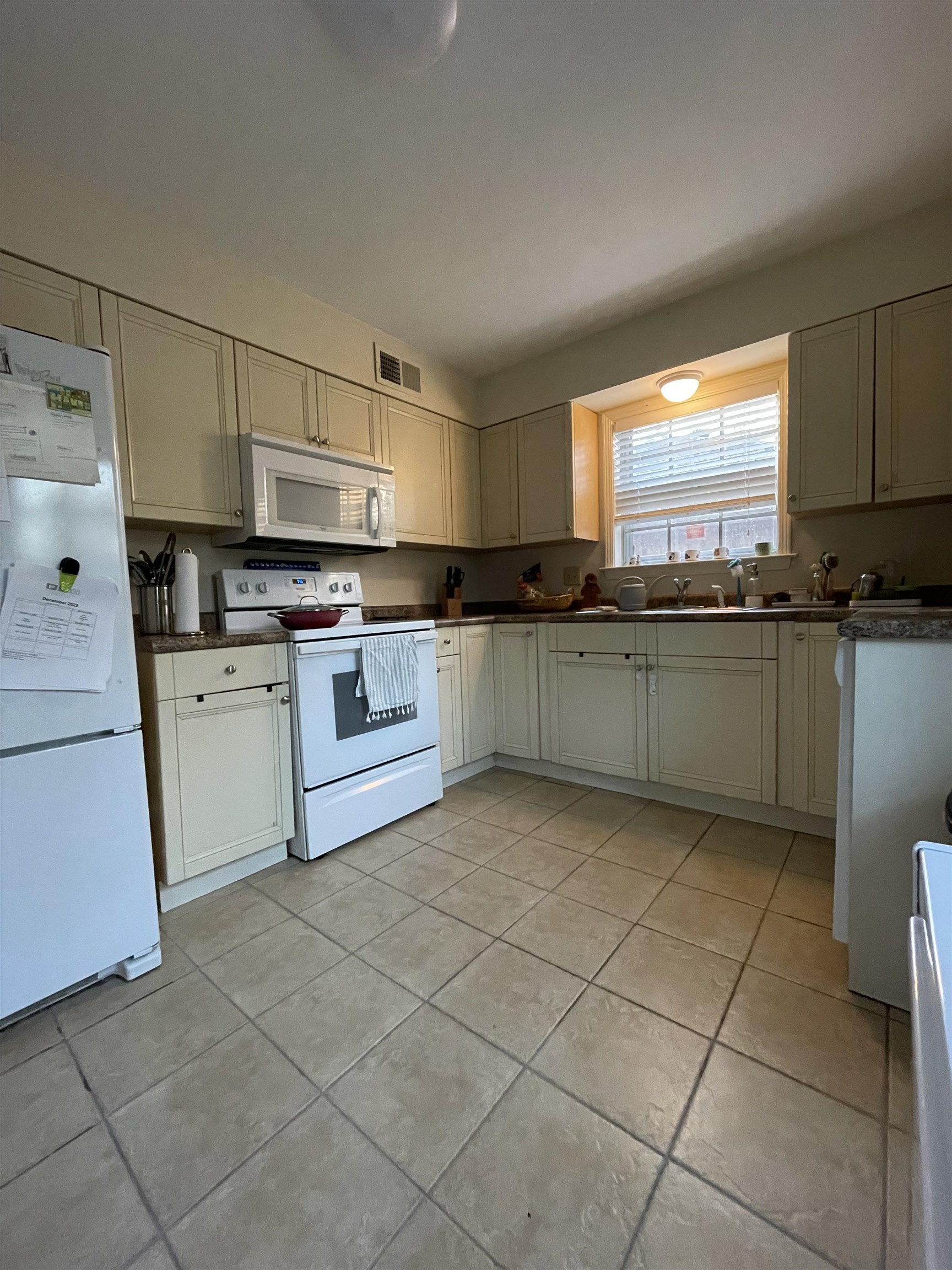 363 South Fenwick Road Memphis, TN 38111 - Photo 8 of 19 a kitchen with stainless steel appliances granite countertop a sink and cabinets