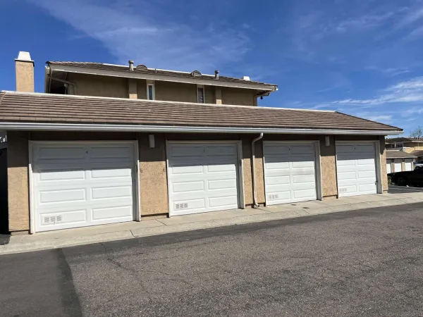 a view of a house with a parking space