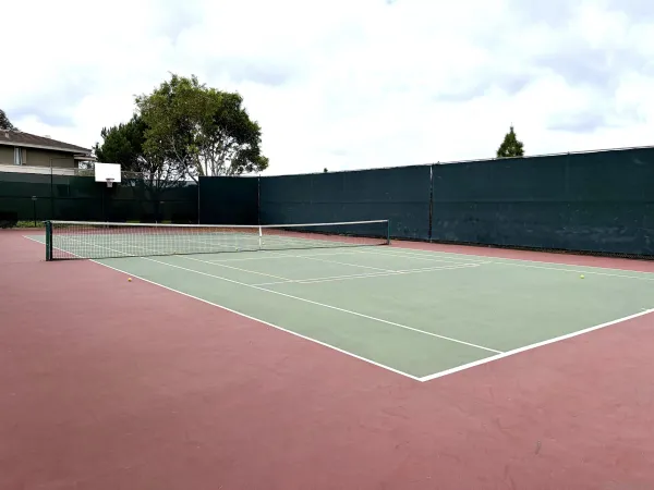 a view of an outdoor space and tennis court