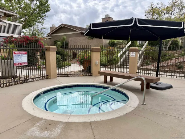 a view of a swimming pool with a patio